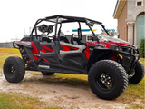 Hostile HF11 Boost black milled wheels installed on a red 2018 Polaris RZR XP 4 Turbo, front three-quarter view. Owner build via Function Powersports.