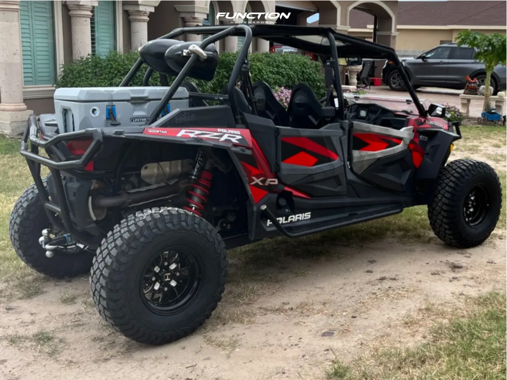 Hostile HF11 Boost black milled wheels installed on a red 2018 Polaris RZR XP 4 Turbo, rear three-quarter view. Owner build via Function Powersports.
