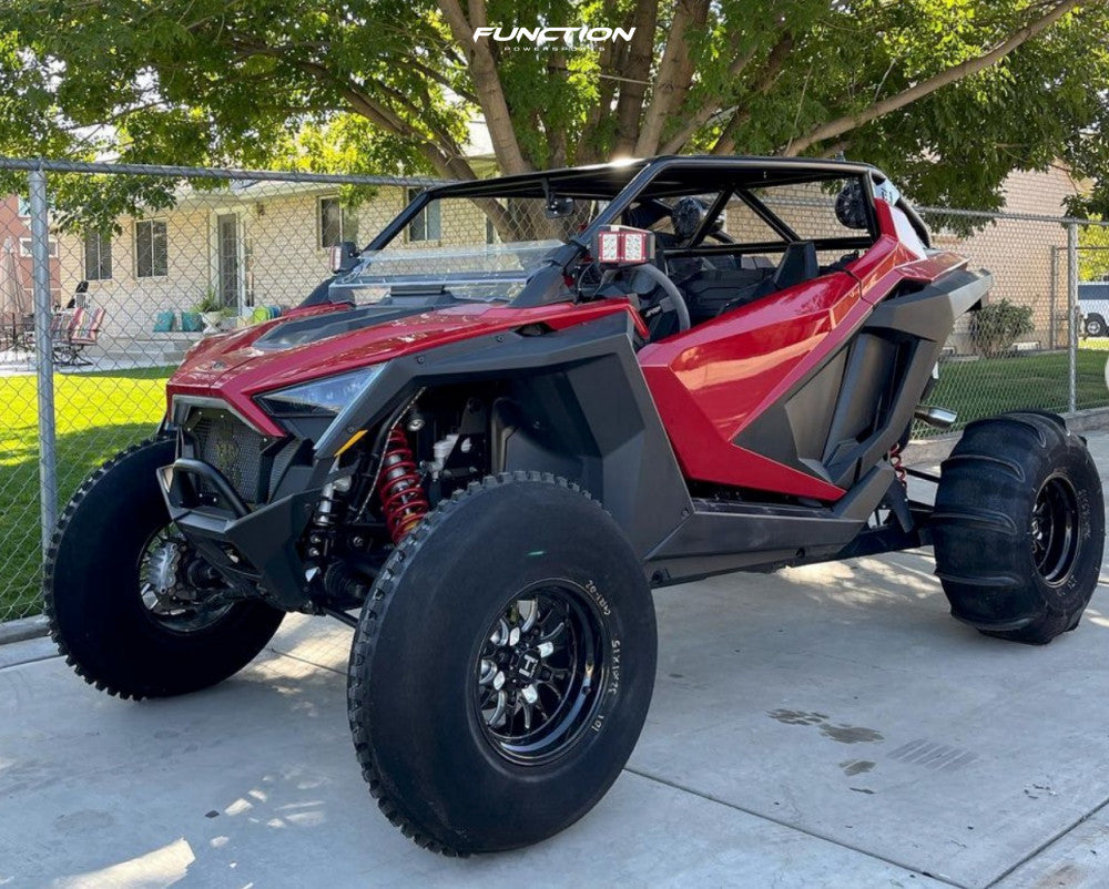 Hostile HF11 Boost wheels installed on a red 2021 Polaris RZR Pro XP with sand tires. Owner build via Function Powersports.