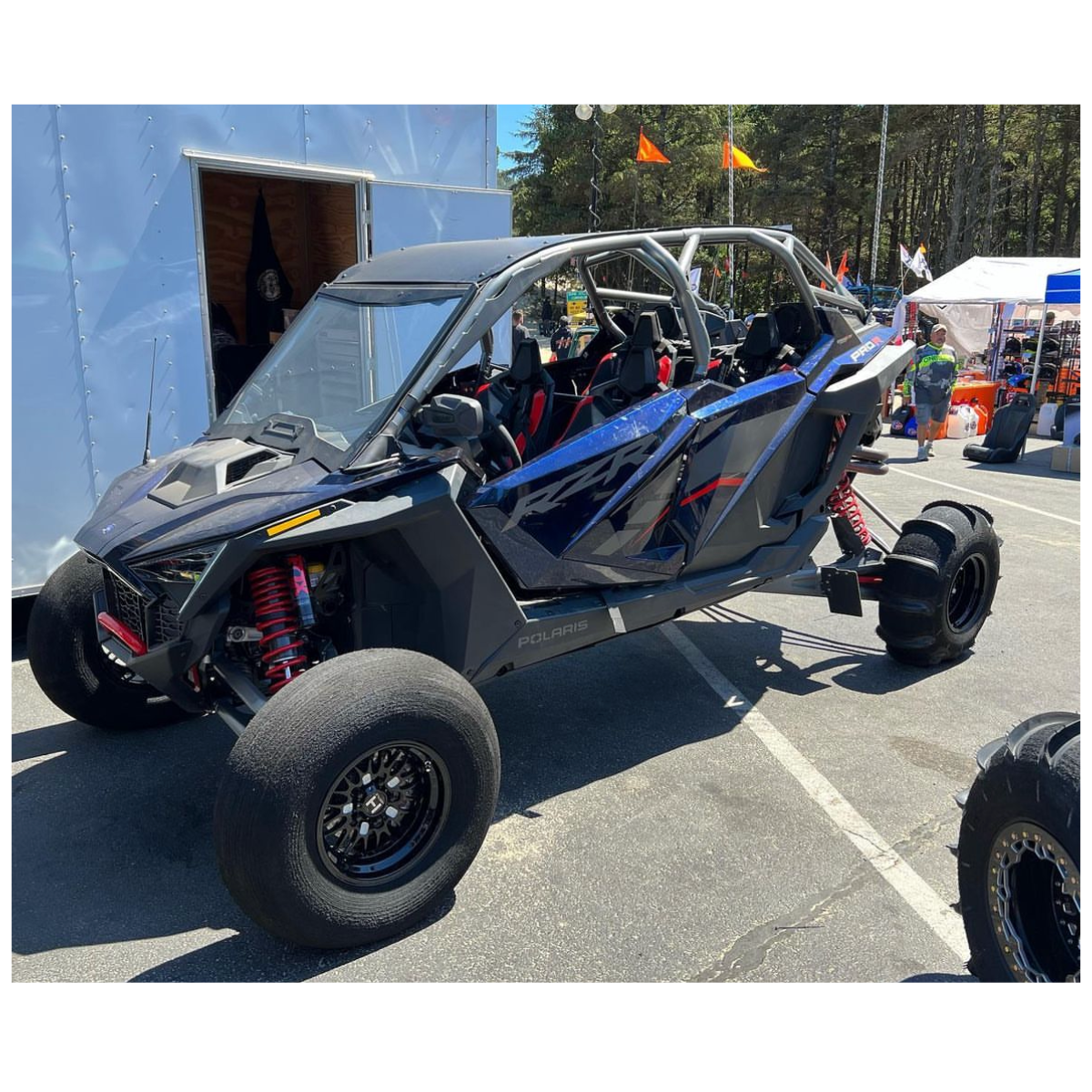 Hostile HF13 Outlaw wheels installed on a blue Polaris RZR Pro R with sand tires. Photo from UTV Obsessions.