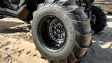 Hostile HF22 Rival installed rear-wheel detail with a sand paddle tire on a Polaris RZR Pro R. Hostile gallery.