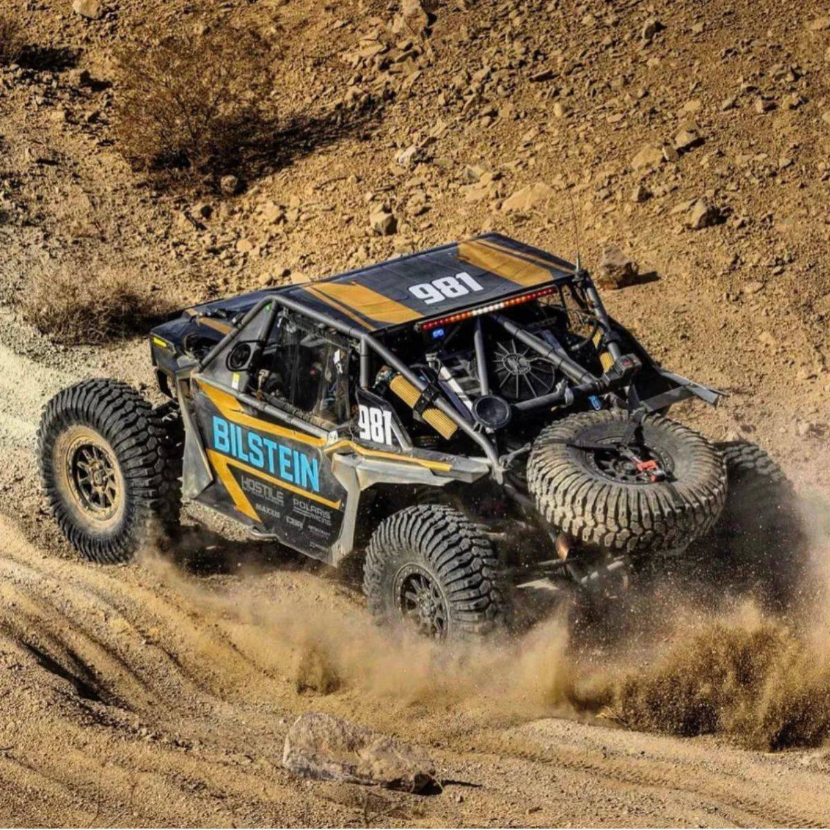Hostile HF23 Baja Beadlock wheels on the number 981 Polaris desert race UTV. Race-action photo from UTV Obsessions' HF23 product gallery.