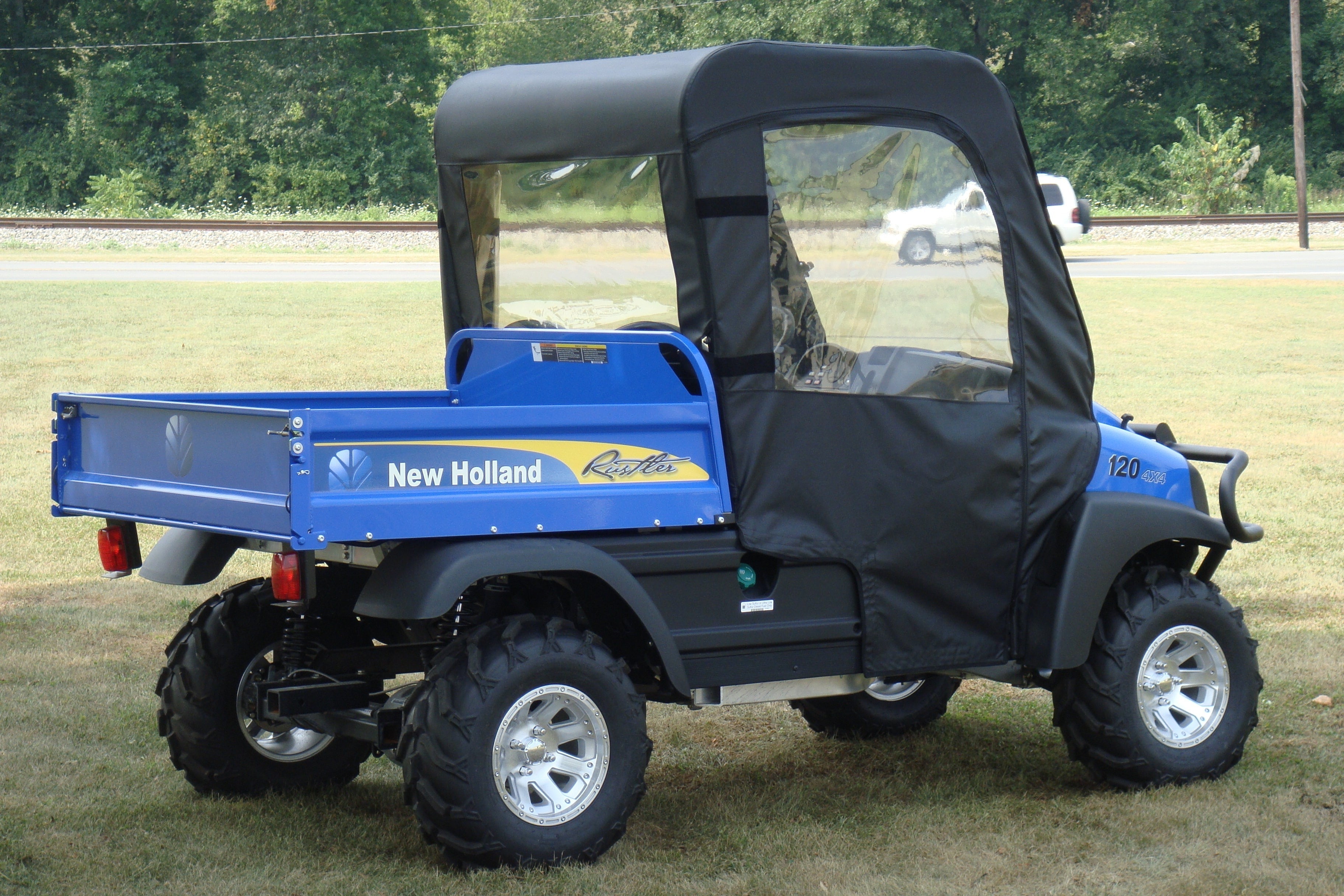 Photo of New Holland Rustler 115 - Full Cab for Hard Windshield with Color and Zip Window Options by 3 Star UTV - Premium Enclosures for UTVs / Side by Sides