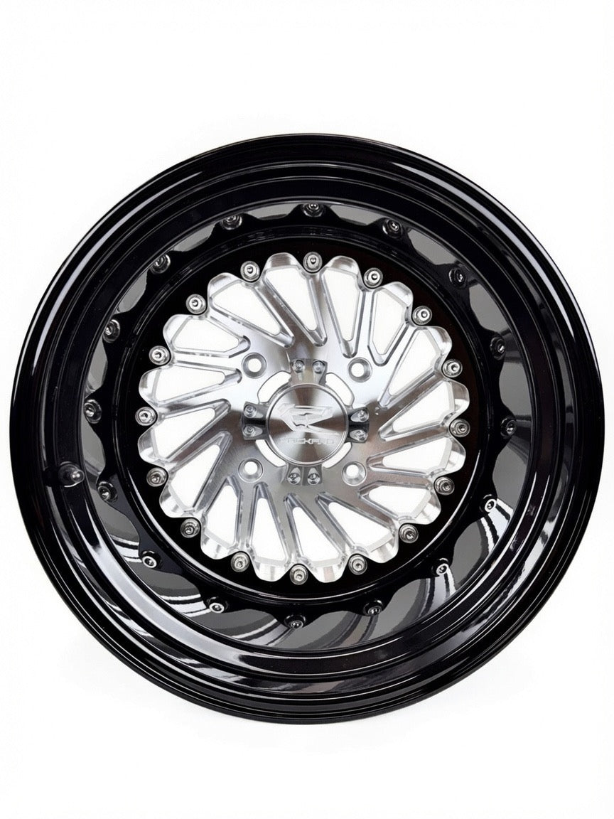 Front view of a Packard Cyclone silver non-beadlock UTV wheel with a black barrel.