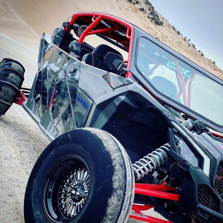 Angled view of a Packard Element silver non-beadlock UTV wheel with a black barrel.