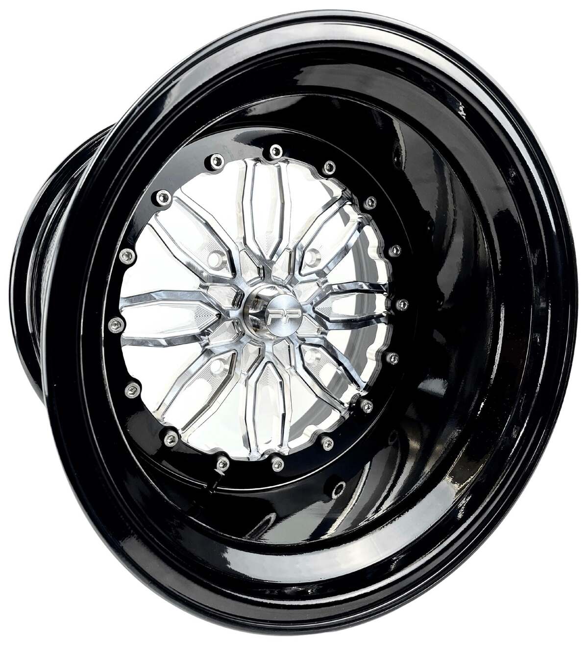 Angled view of a Packard Icon silver non-beadlock UTV wheel with a black barrel.
