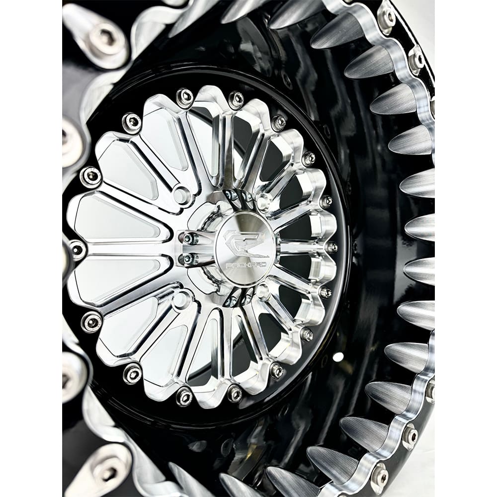 Close-up of a Packard Element silver beadlock UTV wheel with a black barrel.