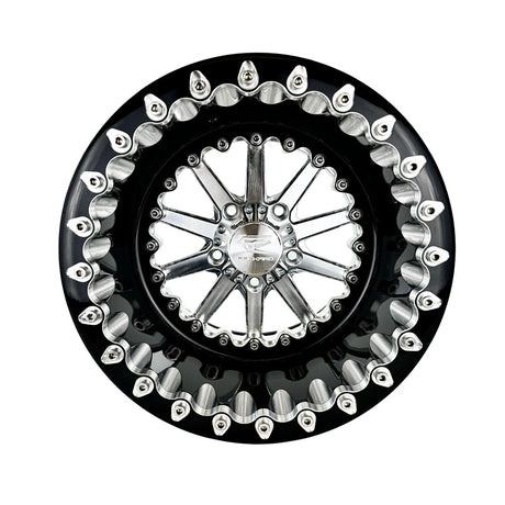 Angled view of a Packard Element silver beadlock UTV wheel with a black barrel.