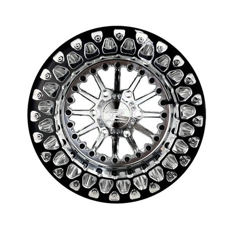 Angled view of a Packard Element silver beadlock UTV wheel with a polished barrel.