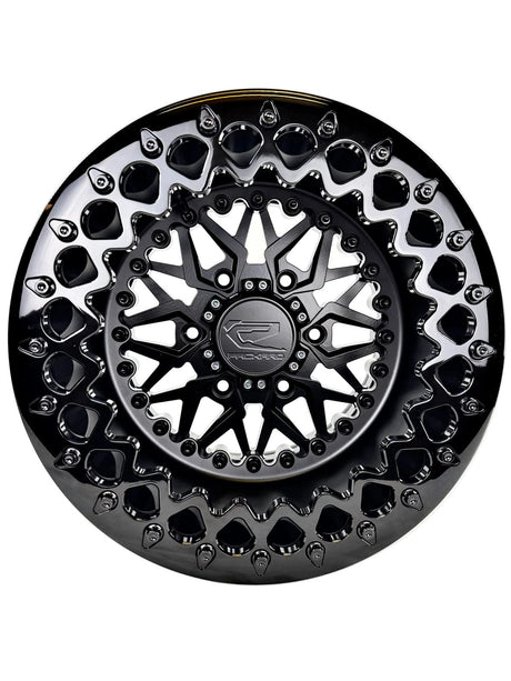 Angled view of a Packard Impact Midnight beadlock UTV wheel with a satin black barrel.