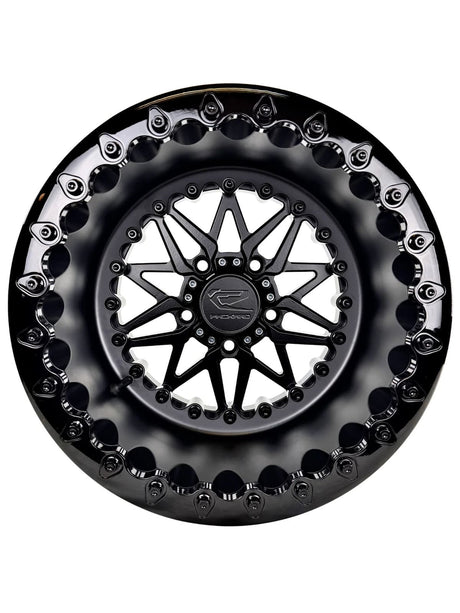 Angled view of a Packard Impact Midnight beadlock UTV wheel with a satin black barrel.