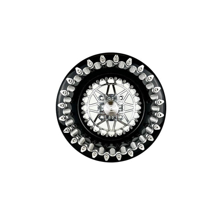 Angled view of a Packard Apollo silver beadlock UTV wheel with a black barrel.
