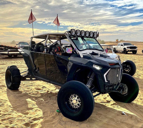 Angled view of a Packard Wishbone silver non-beadlock UTV wheel with a black barrel.