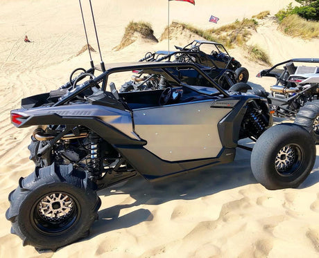 Angled view of a Packard Wishbone silver non-beadlock UTV wheel with a black barrel.