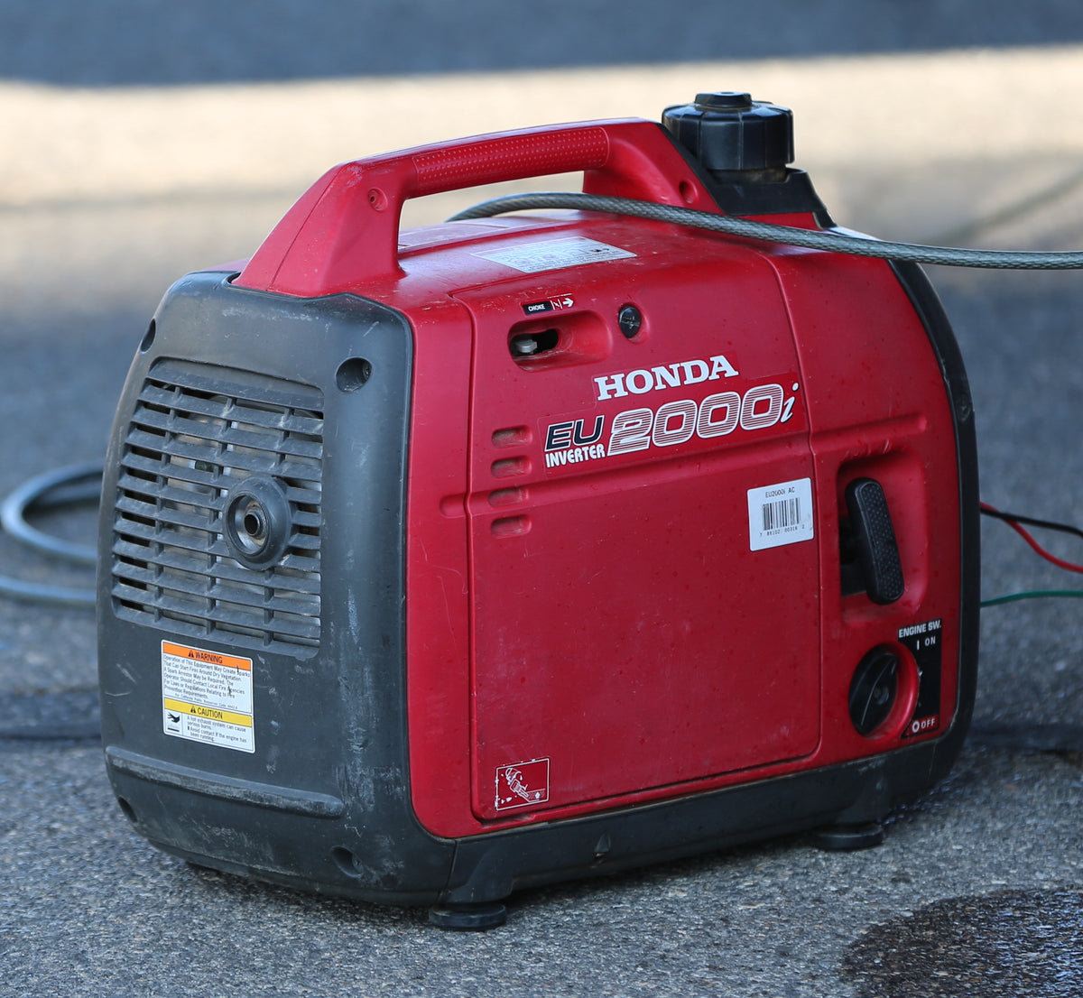 Compact red Honda EU2000i portable inverter generator