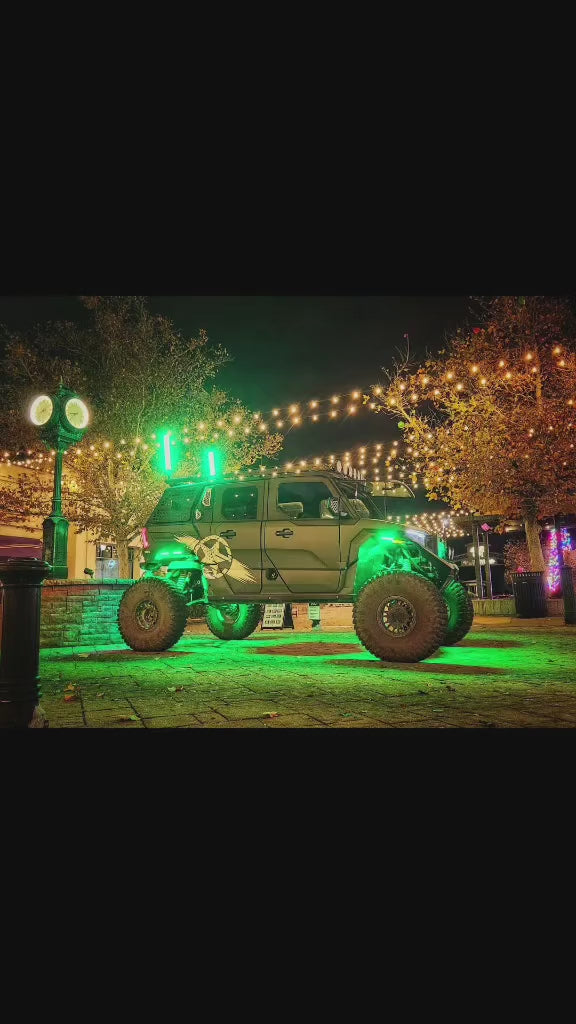 R1 LED whips illuminated on a Jeep at night