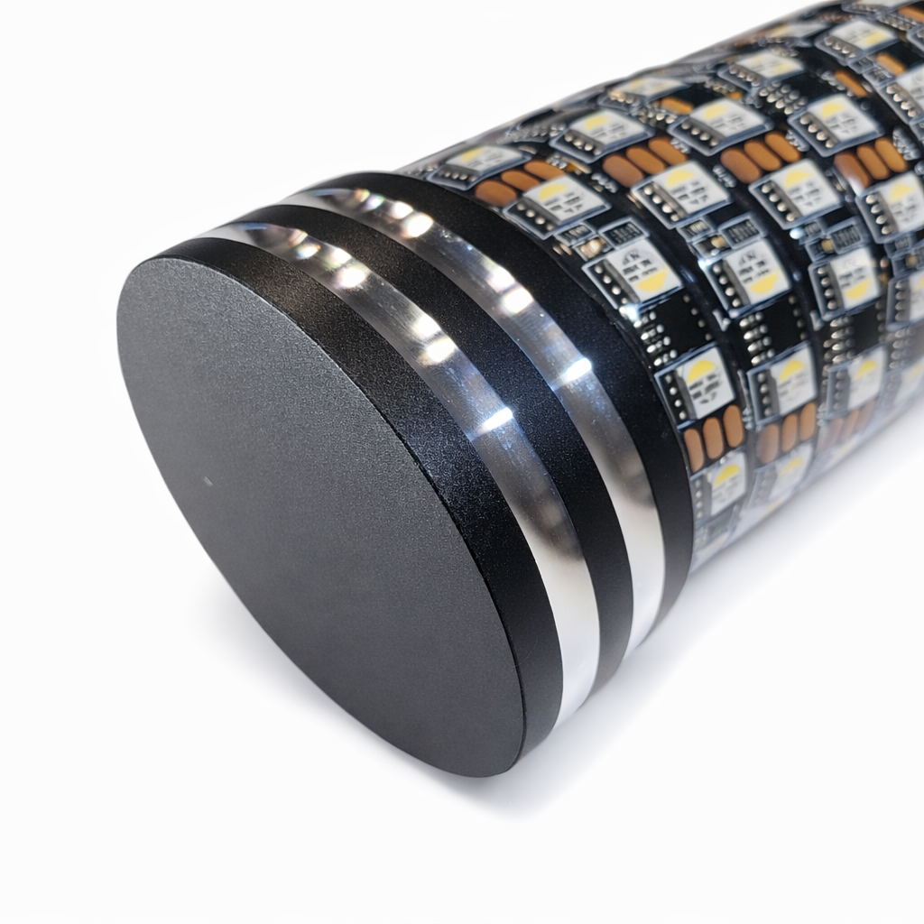 Close-up of a cylindrical electronic component with LED lights on a white background