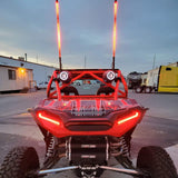 Off-road UTV equipped with red R1 Industries LED whip lights